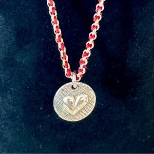 Vintage BRIGHTON, reversible, petite necklace, silk cord, and silver plated.